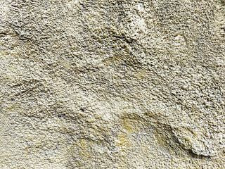 Unfinished cement wall rustic industry design decoration idea .Stucco on the wall with a texture of white and gray.