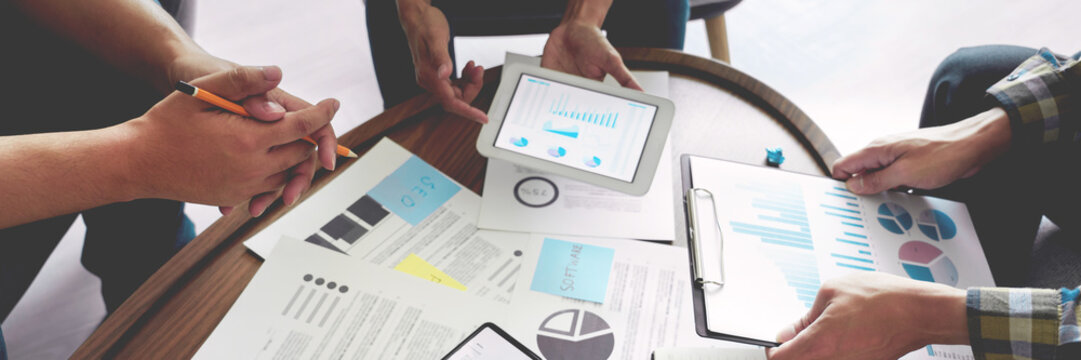 Business people meeting at office writing memos on sticky notes. planning strategy and brainstorming, colleagues thinking concept.