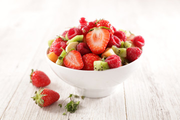 fresh fruit salad with berry fruit, banana, kiwi