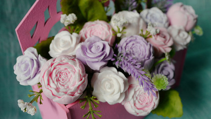 Obraz na płótnie Canvas Bouquet of soap flowers in pink envelope