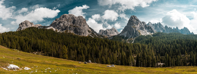 Tre Cimes di Lavaredo. Outdoor Adventure Wide Stitched Panorama. Panoramic Image of Italian Alps