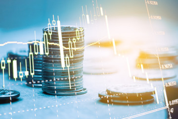 Double exposure of graph , stationary and rows of coins for goal office , finance and business concept background and forex trading graph with economy trends business or finance background.