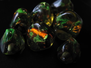 Colorful glass stones on a black background