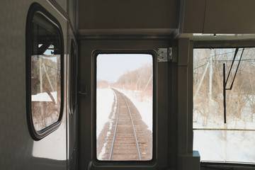 Winter in the hokkaido region, the train tracks are covered in snow, a memorable sight for travelers.