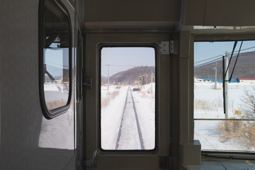 The Japanese train ran past the snow-covered vegetable plantation, indicating an economic disruption.
