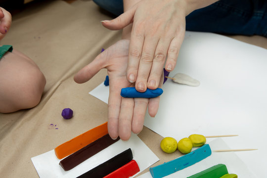 rolling plasticine in the hands. children's crafts. quarantined leisure