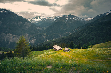 Fototapeta na wymiar House sitting at the heart of the mountains in Grossglockner, Austria