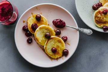 Pancakes with jam and cherries.