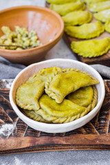Dumplings of whole wheat with stuffed potato filling. Vegan, vegetarian food.