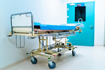 Empty hospital hallway with surgical transport equipment.
