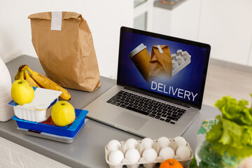 Food Delivery Food Laptop on table. Warm tone