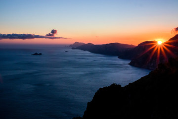 Beautiful view of Amalfi coast seen from the Path of the Gods (Sentiero degli Dei) with Li Galli and Capri Island on the background at sunset. Route from Agerola to Nocelle, Positano, Campania, Italy - obrazy, fototapety, plakaty