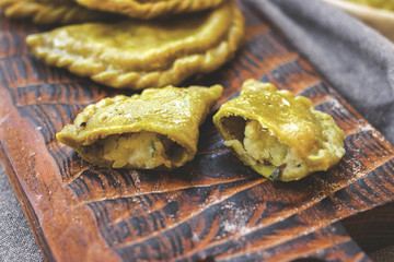 Dumplings of whole wheat with stuffed potato filling. Vegan, vegetarian food.