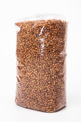 buckwheat in transparent bag on white background
