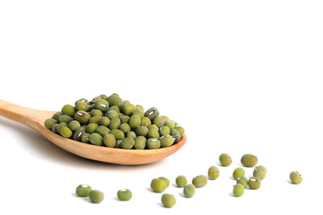 Full scoop of raw mung bean – mung seed on wooden spoon – isolated on a white background