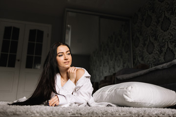 Beautiful girl lying on floor