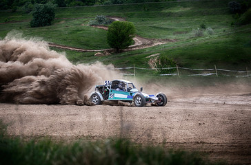 Fototapeta na wymiar Racing sports car in dust clubs on the track , rally