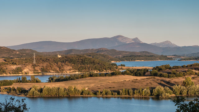 Panoramic view over the Ullibarri-Gamboa Reservoir and the Gorbeia mountain range after sunrise