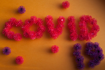 Inscription COVID-19 with coronavirus-like elements. COVID-19 pandemic.