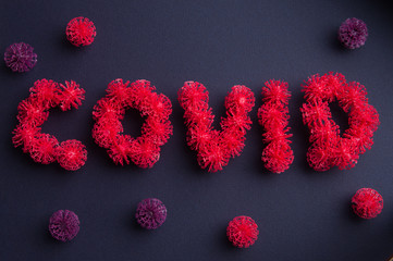 Inscription COVID-19 with coronavirus-like elements. COVID-19 pandemic.