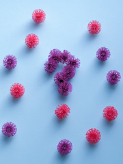Coronavirus plastic models question mark on a neutral background. Sars-cov-2 pandemic concept COVID-19 pandemic concept 