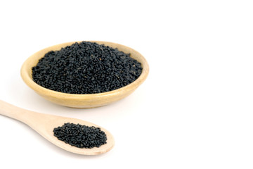 Top view sweet basil seeds on wooden bowl and spoon – isolated on white background