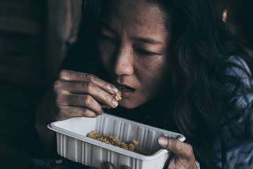 poor people,homeless or beggar begging for help sitting at dirty slum.concept for poverty...