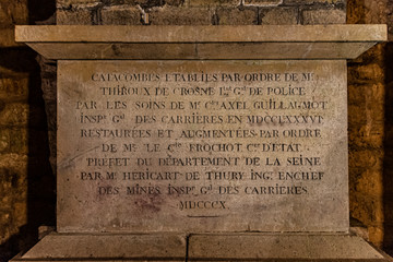 underground catacombs full of bones, gravestones and inscriptions