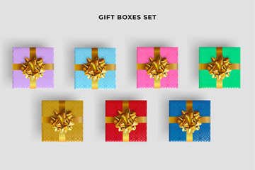 Set of colorful gift boxes with realistic gold bow. Top view.