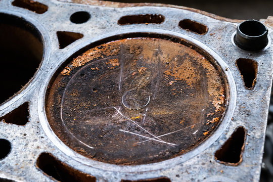 Image Of Repair  Rusty Gasoline Piston.