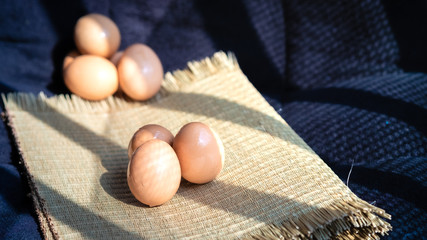 Chicken eggs with a black background, chicken eggs with natural light, chicken eggs are the food that every home needs, chicken eggs are very useful and protein.