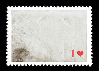 Vintage blank postage stamp and one red heart on a black background. Valentine's Day.