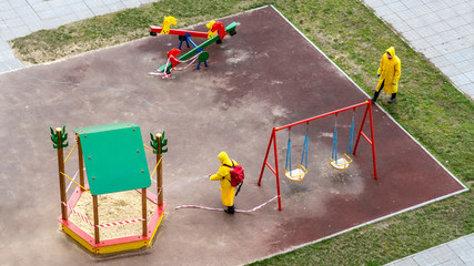 Disinfection of a playground in a city courtyard