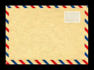 Vintage postage envelope on a black background, message, air mail