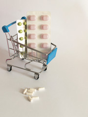 pills in a basket on a white background
