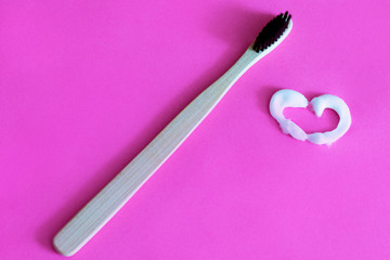 wooden toothbrush and heart paste
