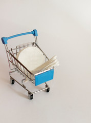 cotton pads and paper cotton buds in a basket

