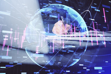 Double exposure of businessman with laptop and stock market forex chart.