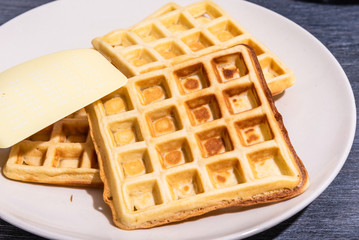 Freshly made Belgian homemade waffles on a plate