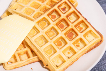 Freshly made Belgian homemade waffles on a plate