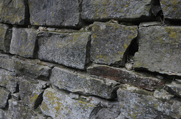 Ancient fence made of natural stone
