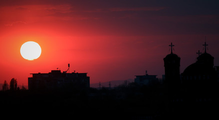 Beautiful sunset above the city skyline  , The city of Ploiesti, Romania with a beautiful sun