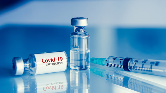 Vaccine vial dose flu shot drug needle syringe,medical concept . blue background. selection focus.