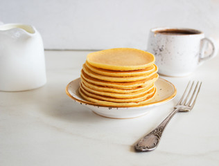 stack of sweet  pancakes with coffee on white background.