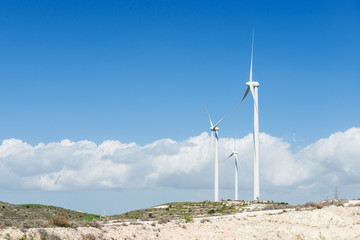 Windmills in the windy hills.Energy and power of wind using for electric power.Copy space