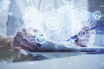 Social network theme hologram over woman's hands writing background. Concept of international people connect. Double exposure