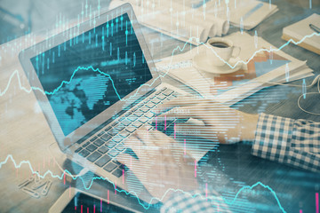 Double exposure of forex graph with man working on computer on background. Concept of market analysis.