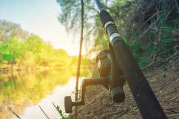 fisherman on the river spinning sunset