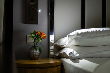 Nightly turndown service inside bedroom with king or queen double bed on luxury cruiseship or...