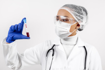 Scientist doctor holding positive blood test tube sample for coronavirus. Coronavirus outbreak and...